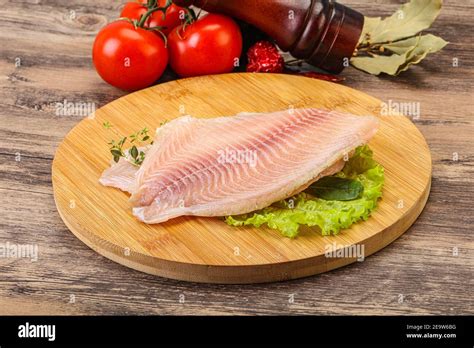 Raw Tilapia Fish Fillet For Cooking Stock Photo Alamy