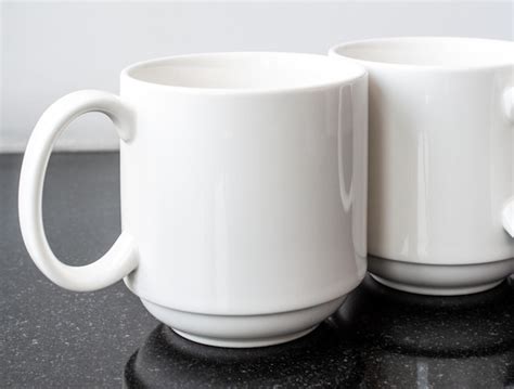 Premium Photo Two White Conference Coffee Mugs Standing Next To Each