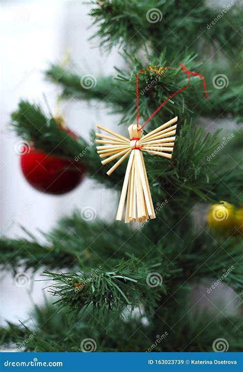 A Christmas Tree Decoration Made from Natural Biodegradable Materials Hangs on a Christmas Tree ...