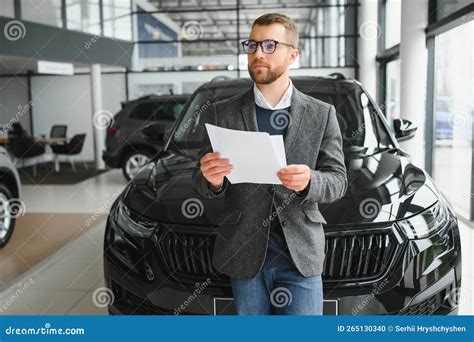 Portrait of a Handsome Salesman in the Suit Standing Near the Car in ...