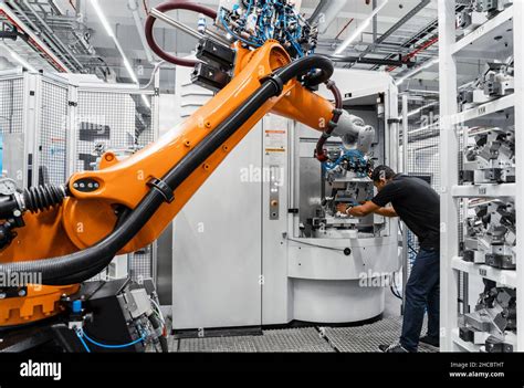 Maintenance Engineer Repairing Robotic Arm In Industry Stock Photo Alamy