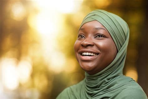 1000 Portrait Of A Laughing Muslim Woman Wearing A Headscarf Stock