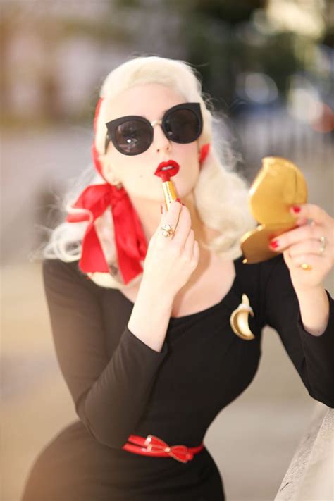 Blonde Applying Red Lipstick Eyeshadow