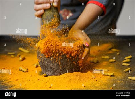 Woman Hand Powdering Indian Spices Turmeric Powder Splash Explosion