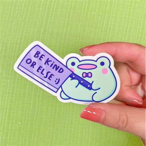 A Sticker Of Friend The Frog Holding A Knife That Says Be Kind Or Else