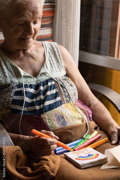 Old Lesbian Woman Smiling While Drawing A Picture With Rainbow Colors Love Is Love Lgtb