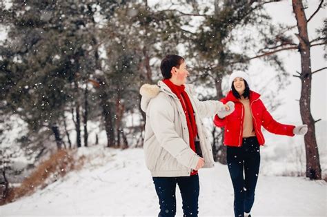 Free Photo | Loving couple walking in a winter park