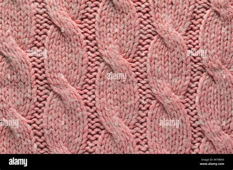 Knit Texture Of Pink Wool Knitted Fabric With Regular Cable Knitted