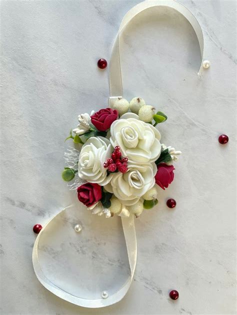 A Bridal Bouquet With Red And White Flowers On A Marble Surface Ready