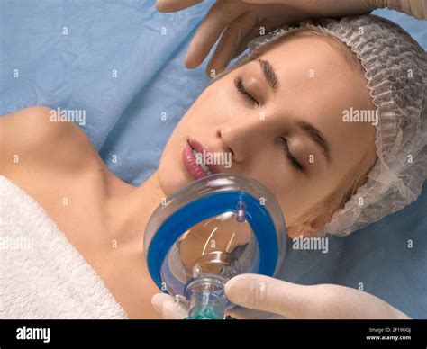 Doctor Gives Anesthesia To The Patient Before Surgery Or Beauty