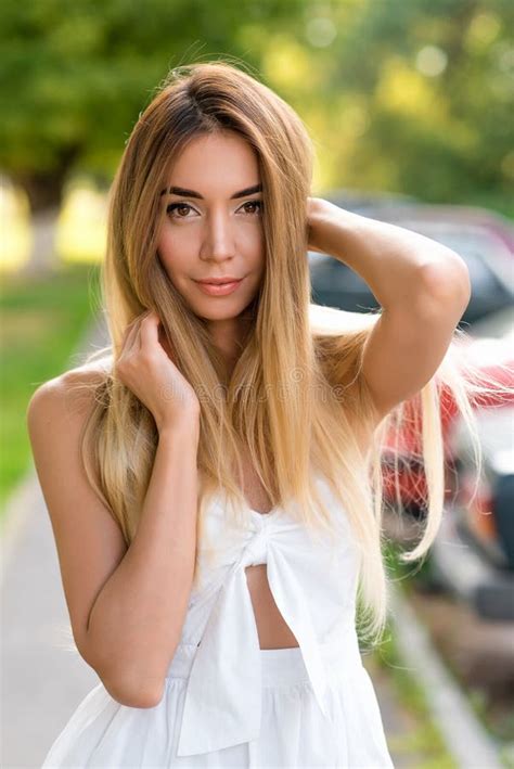 Beautiful And Gentle Woman In White Dress Happy Smiling Hair