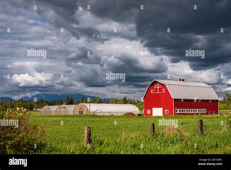 Agriculture Landscape With Old Red Barn In Overcast Day Countryside