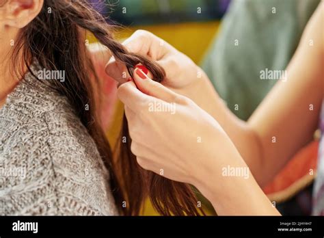 Let Me Do Your Hair A Woman Braiding Her Friends Hair Stock Photo Alamy