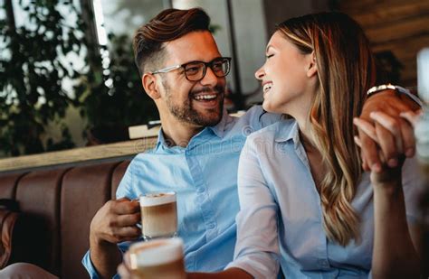 Romantic Loving Couple Drinking Coffee Having A Date In The Cafe