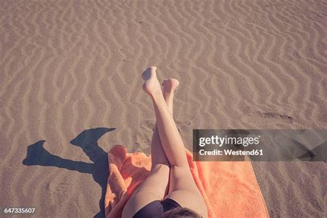 Female Legs Beach Lying Photos And Premium High Res Pictures Getty Images