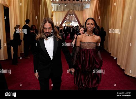 Marco Perego Saldana Left And Zoe Saldana Arrive At The Oscars On