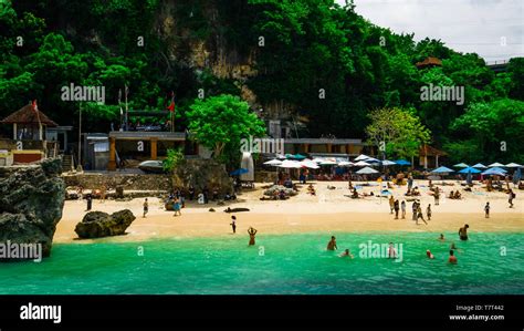 Tourists relax at the Padang Padang Beach featured in the movie "Eat ...