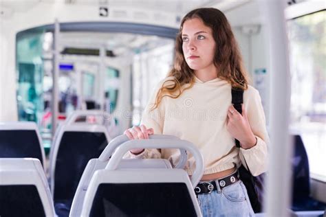 Portrait Of A Focused Girl Riding On Public Transport Stock Image