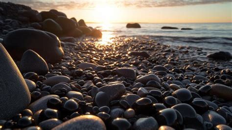 Puesta De Sol Sobre El Mar Piedras A La Orilla Del Mar Foto Premium