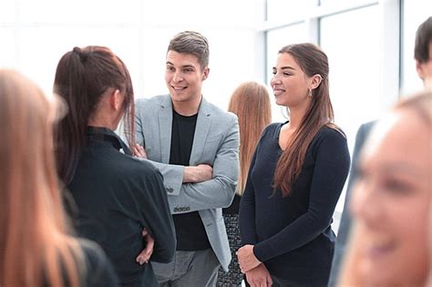 Multicultural Team Members Standing Together In The Workplace Photo