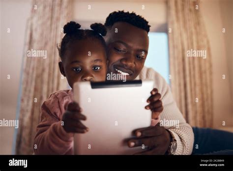 Shot Of A Father Reading His Daughter Bedtime Stories Stock Photo Alamy