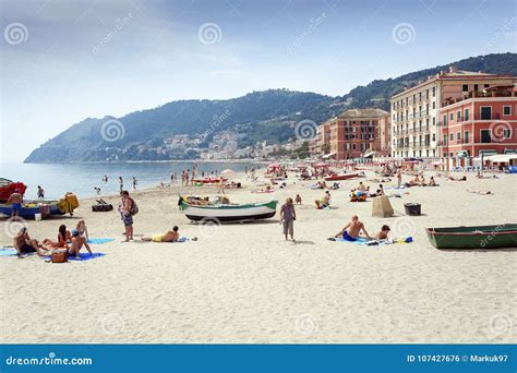 Laigueglia Beach With Sunbathers Editorial Photo Image Of Buildings