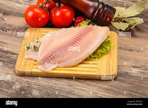 Raw Tilapia Fish Fillet For Cooking Stock Photo Alamy