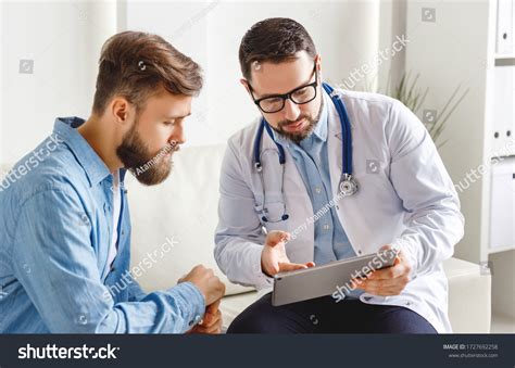 Medical Practitioner Glasses Showing Test Results Stock Photo