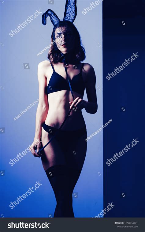 Sexy Brunette Posing Nude Wearing Bunny Stock Photo