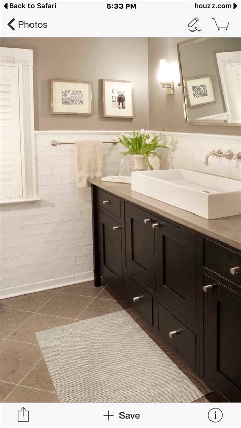 White vessel sink, beige granite, dark cabinets. Will need to bring in ...