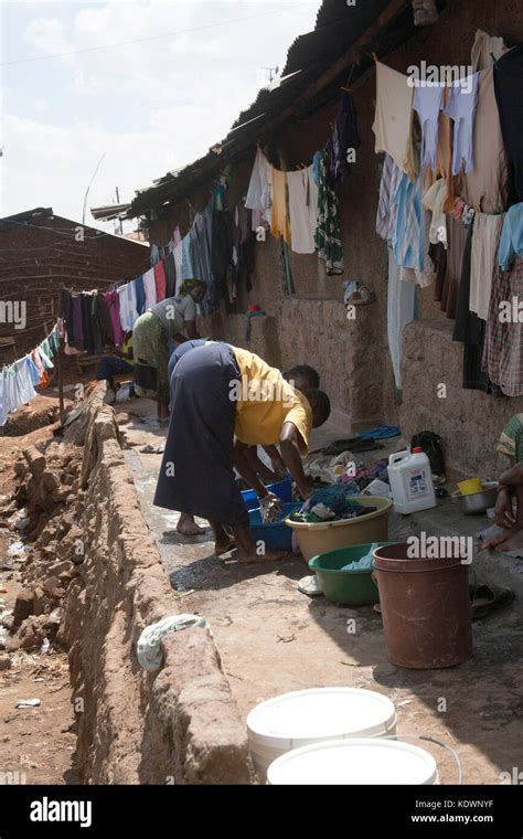 Women Washing Clothes In Kibera Slum Nairobi Kenya East Africa Stock