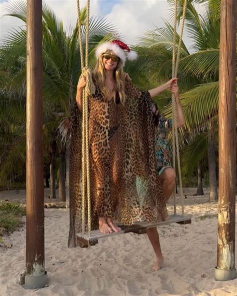 Heidi Klum Wows In Black String Bikini And Sheer Leopard Print Kaftan