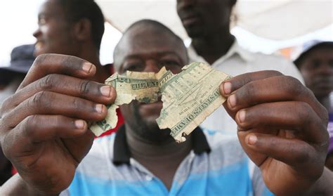 Zimbabweans Mend Shabby Dollar Notes Amid Economic Crisis Arab News