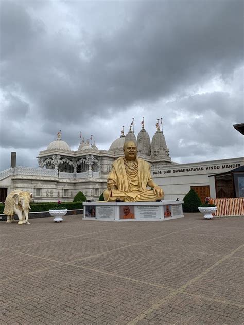 BAPS Shri Swaminarayan Mandir With Gilded Buddha And Ornate Elephant