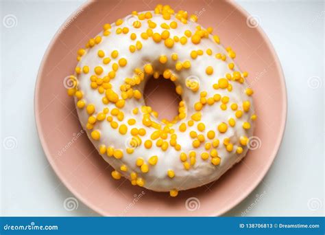 Tasty White Donut With Yellow Round Sprinkles Background Texture