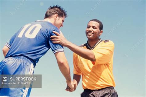 Low Angle View Of Two Soccer Players Shaking Hands Superstock