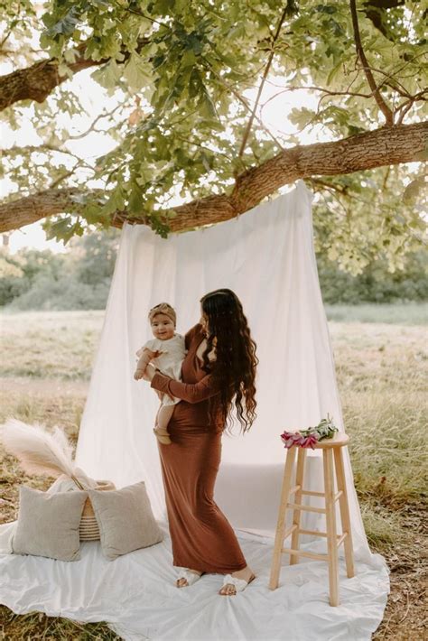 Mommy And Me Boho Photoshoot White Sheet Outdoor Grassy Field Brown Maxi Dress Neutrals