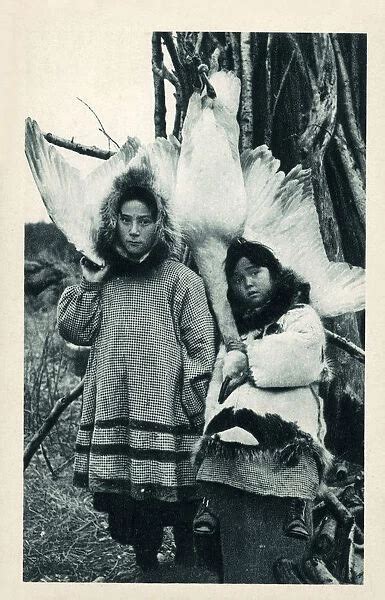 Two young Eskimo (Inuit) children with a captured #18952820 Framed