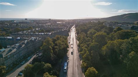 An aerial view of a city street with cars and trees · Free Stock Photo