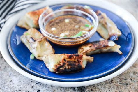 Cooking Trader Joes Thai Vegetable Gyoza In A Pan From Frozen Sip Bite Go