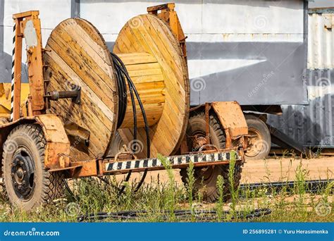 Wooden Reel With High Voltage Cable Mounted On A Trailer For Easy Transport And Stowage Laying