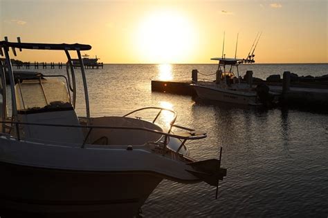 sunset with dock and boats - Jolly Roger