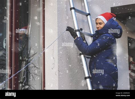 Installing Christmas Lights On House Hi Res Stock Photography And