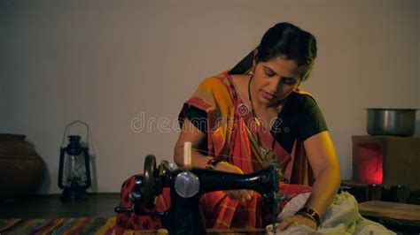 Indian Village Woman Making Food In Ancient Or Old Kitchen Stock