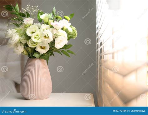 Bouquet Of Beautiful Flowers On Nightstand In Bedroom Space For Text