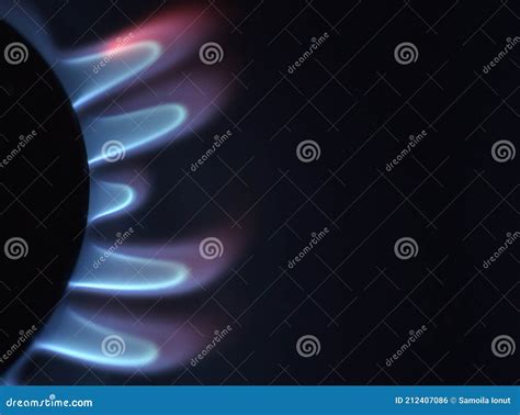 Natural Gas Burning A Blue Flames On Black Background Stock Photo