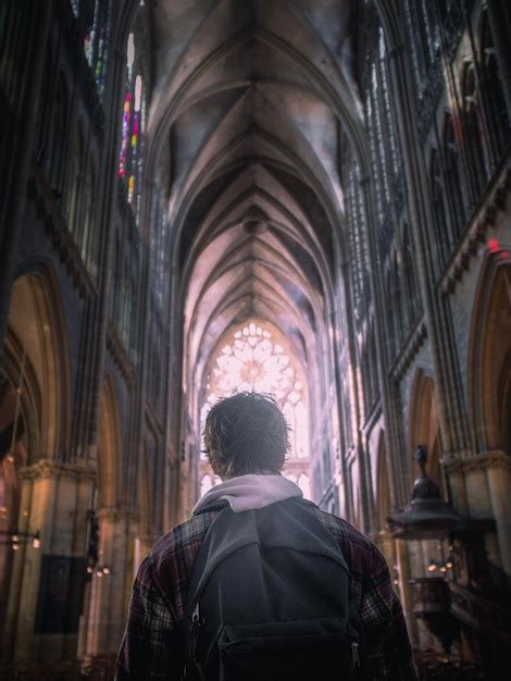 Premium Photo Rear View Of Man Standing In Temple Against Building