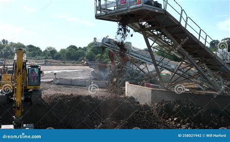 Earth Being Moved By A Conveyor Awaiting A Digger To Load To A Tipper