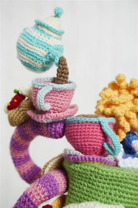 There Are Crocheted Items That Look Like Cups And Saucers On Top Of