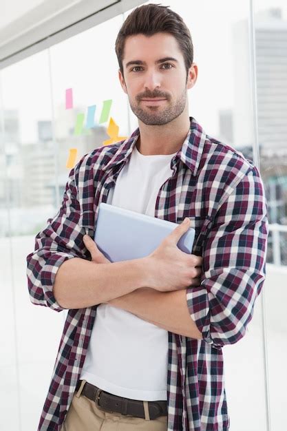 Premium Photo Cheerful Businessman Standing And Holding Tablet